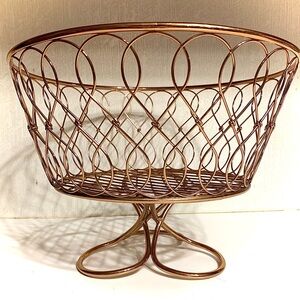 Copper Wire Basket with Intricate Design, elevated base.